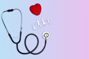 family health care and insurance concept with stethoscope