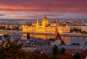 Fototapeta na wymiar Illuminated Hungarian Parliament building at sunset in Budapest, Hungary