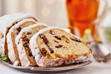 Traditional Christmas cake close-up on light wooden table