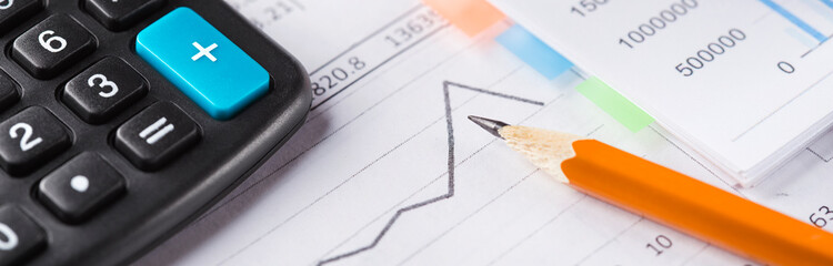 Fototapeta premium Accounting document with pencil and checking financial chart. Concept of banking, financial report and financial audit.