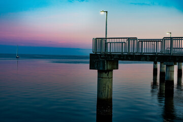 Pier over the Gulf of Mexico at sunset with vibrant colors
