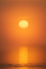 Abstract of a sunset over the Gulf of Mexico with an orange sky