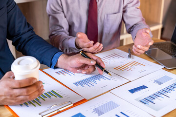 Business people analyze data for market planning, financial charts to analyze profits, investment results and company's financial performance, investment development consulting.