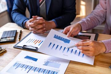 Business people analyze data for market planning, financial charts to analyze profits, investment results and company's financial performance, investment development consulting.