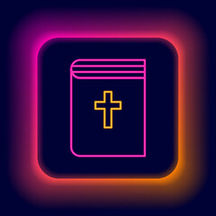 Glowing neon line Holy bible book icon isolated on black background. Colorful outline concept. Vector