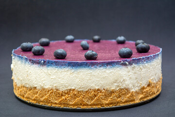 Unbaked blueberry cheesecake on an empty space with close ups 