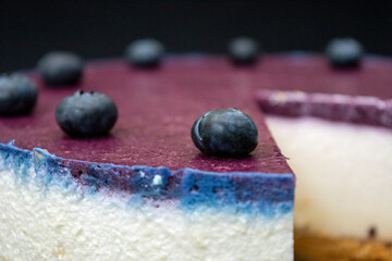 Unbaked blueberry cheesecake on an empty space with close ups 