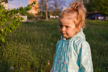 Little cute girl in the park, soft focus background
