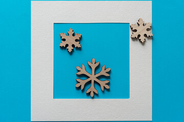 christmas snowflakes made of wood on paper with frame