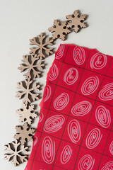 wooden snowflake shapes and fancy pattern on a grid
