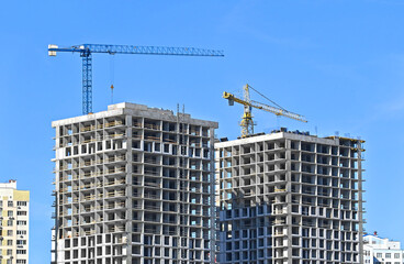 Crane and highrise construction site