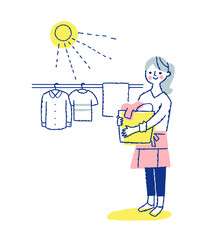 洗濯物を干す女性