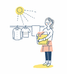 洗濯物を干す女性