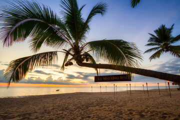 Beautiful sunset on the beach of Ko Kho Khao island with palm trees, Thailand