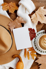 Autumn Leaves Composition with White Paper Sheet on Wooden Background, Top View of Set for Copy Space. Beautiful Autumn Foliage with Blank White Note Template for Greeting Card, Sale, Advertising