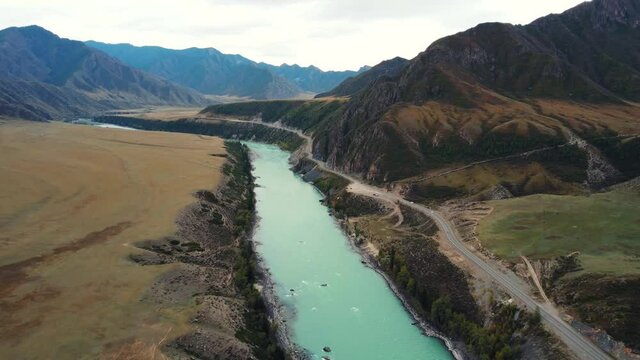 Bird's-eye view of the calm mountain green Katun River. Autumn landscape of the wild nature of the Altai Territory.