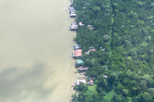 Aerial view of houses and restaurants on the riverbank of Combu Island, which belongs to the municipality of Belem, Para state, Brazil.