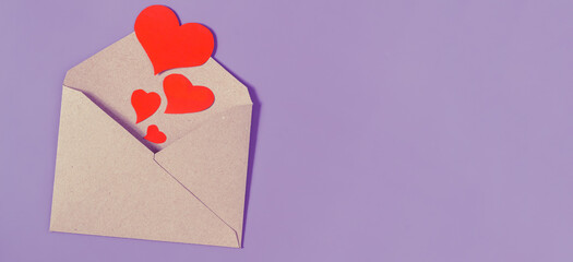 Several hearts of different sizes are sent out of the envelope.