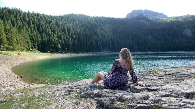 Beauty of nature and person, A girl with Amaizing view on Durmitor lake and mountains, National Park, Mediterranean, Montenegro, relexing, slow life concept	