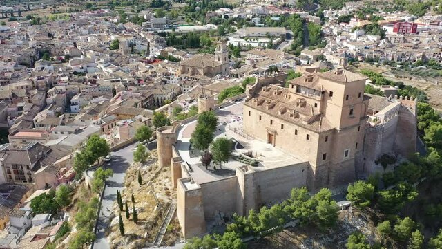 View from drone of historic center of Spanish city of Caravaca de la Cruz overlooking ancient fortified Castle and Basilica of Vera Cruz, region of Murcia