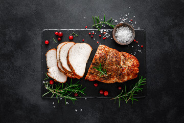 Christmas turkey ham roasted for festive dinner on black background. Top view - obrazy, fototapety, plakaty