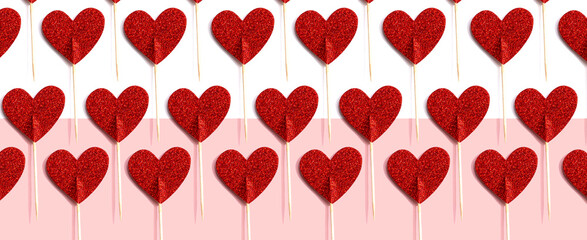Fototapeta na wymiar Valentines day or Appreciation theme with red glitter heart picks