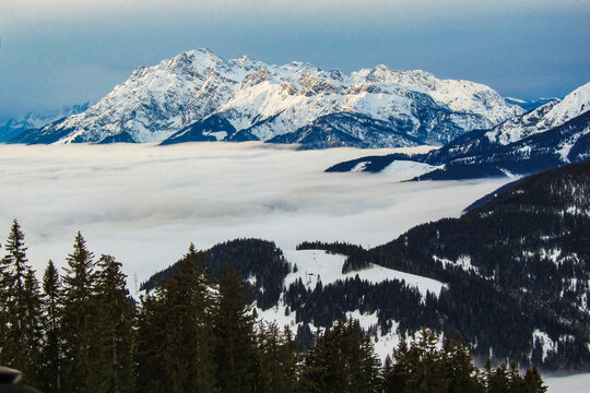 Winter landscape, stunning mountain range, snowy trees and blue sky at Maria Alm, Hinterthal in Austria