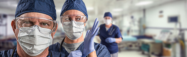 Team of Female and Male Doctors or Nurses Wearing Personal Protective Equiment In Hospital...