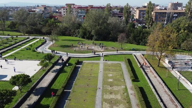 Normal life routine - free time in city park with couple jogging. Naples, Pomigliano d'Arco. Top aerial view