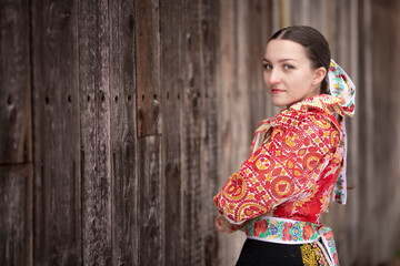 Young beautiful slovak woman in traditional dress. Slovak folklore