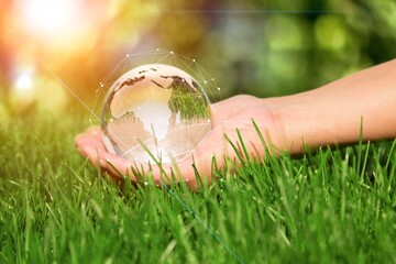 Global communication network. Hands holding earth globe and circle global network connection.
