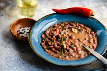 Healthy bean, lobio, soup with spicy pepper and dry wine