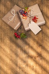 Beautiful gift box with ribbon on wood background, decorative container for putting presents in.