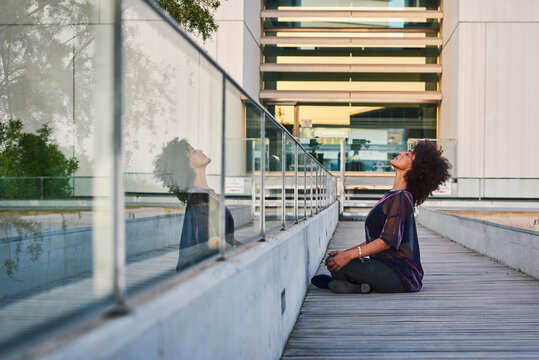Woman doing yoga in the city