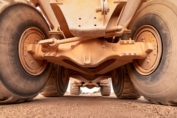 View of the underside of a large construction dump truck