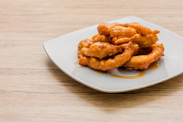 Picarones Peruvian traditional snack delicious food with honey