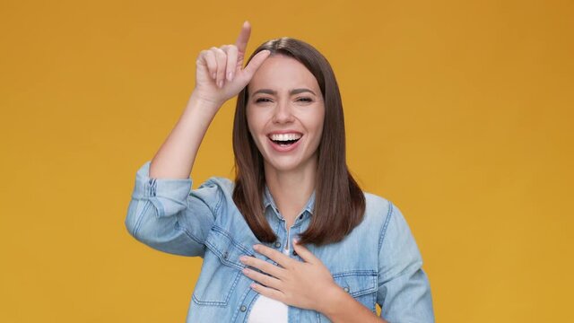 Lady disrespect show head lose symbol isolated beige mustard color background