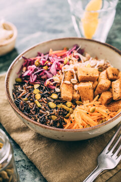 Food: budda bowl with vegetables , tofu and black rice