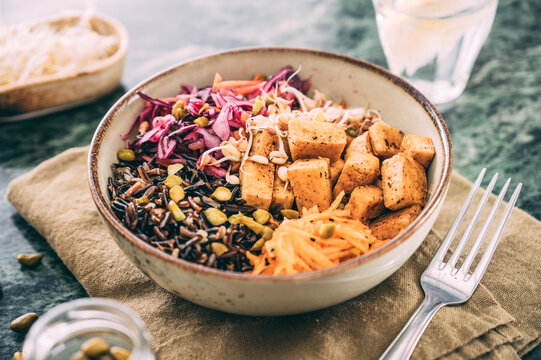 Food: budda bowl with vegetables , tofu and black rice