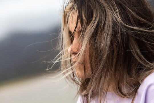 Young girl's hair blowing in the wind