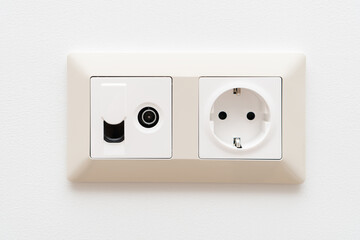 Sockets on white wall. Multifunction outlet with internet connection, tv and electric socket plug with grounding.