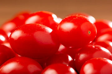 Fresh grape tomatoes in a bowl on the table.