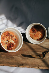 Ham Cheese Croissant with Bacon on wooden board under morning sunlight, horizontal composition. Comfort food concept