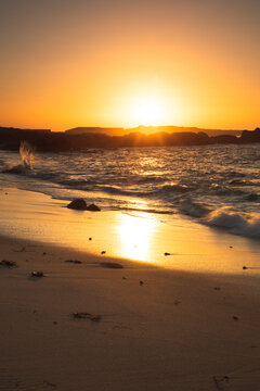 Sunset on a beach with rock formations