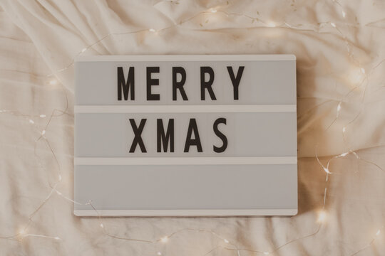 merry xmas sign board with fairy lights