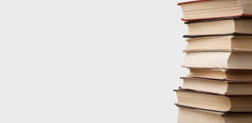 Stack of books in the colored cover lay on the table . Education learning concept