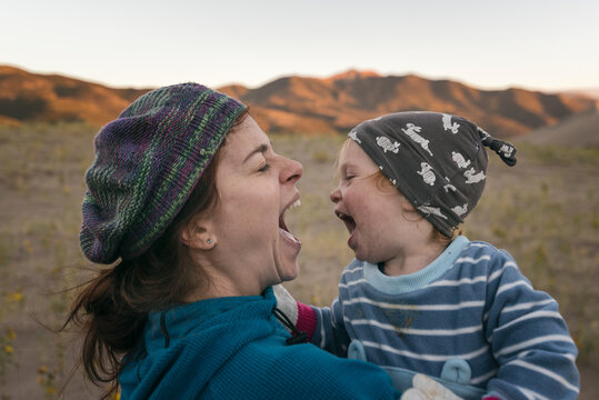 Mother and daughter having fun in the desert