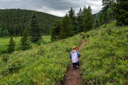 Girl hiking on a trail in the Mountains, Colorado