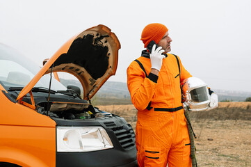 Man dressed as astronaut using smart phone
