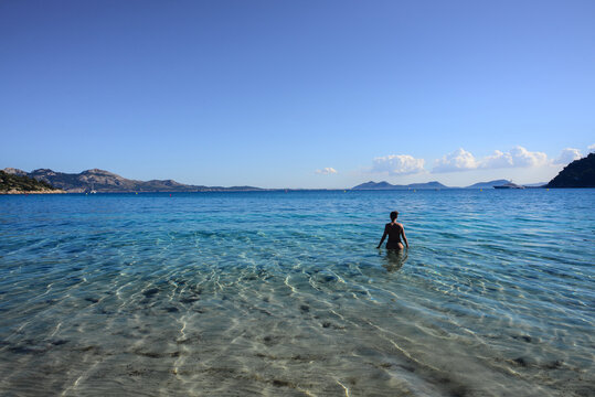 Young woman in a paradisiac beach of Mallorca